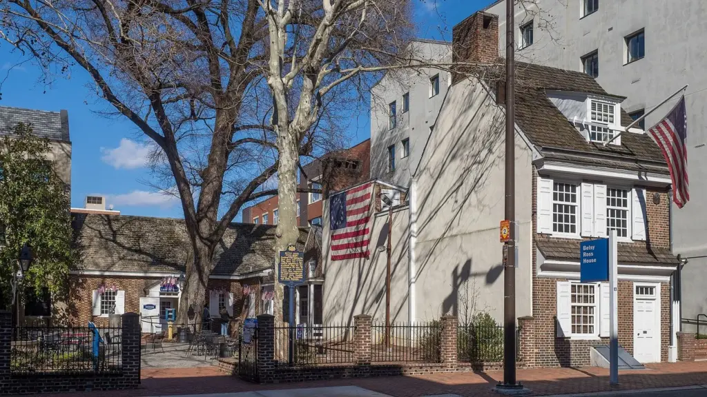 The narrow colonial Betsy Ross House on Arch Street with an American flag out front