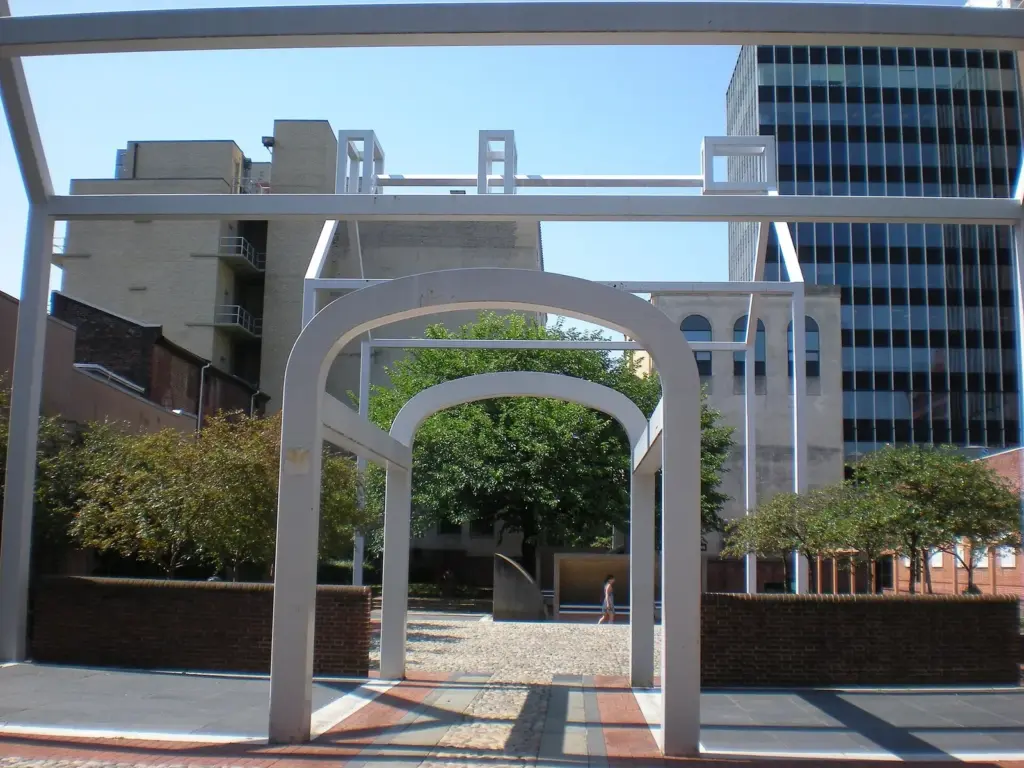 White steel frames outlining the shape of Benjamin Franklin's vanished house in Franklin Court