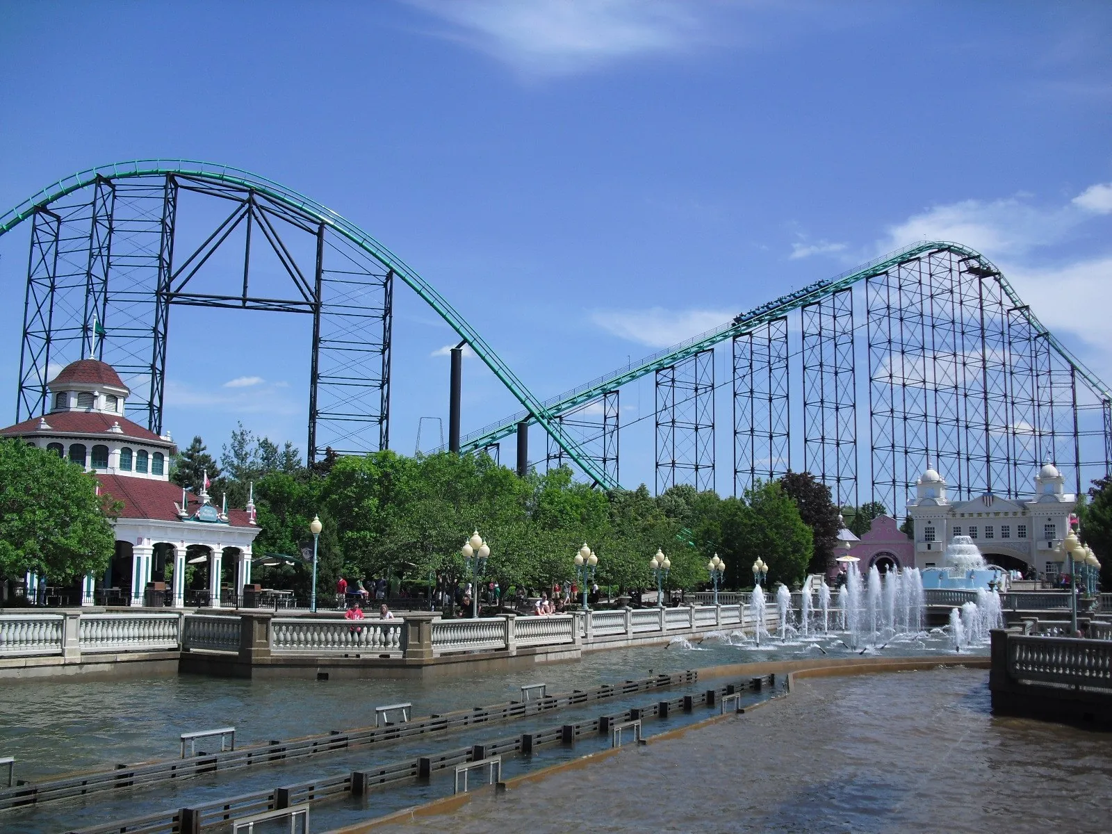 Kennywood's green steel roller coaster arcing over the lagoon, among the best amusement parks in Pennsylvania