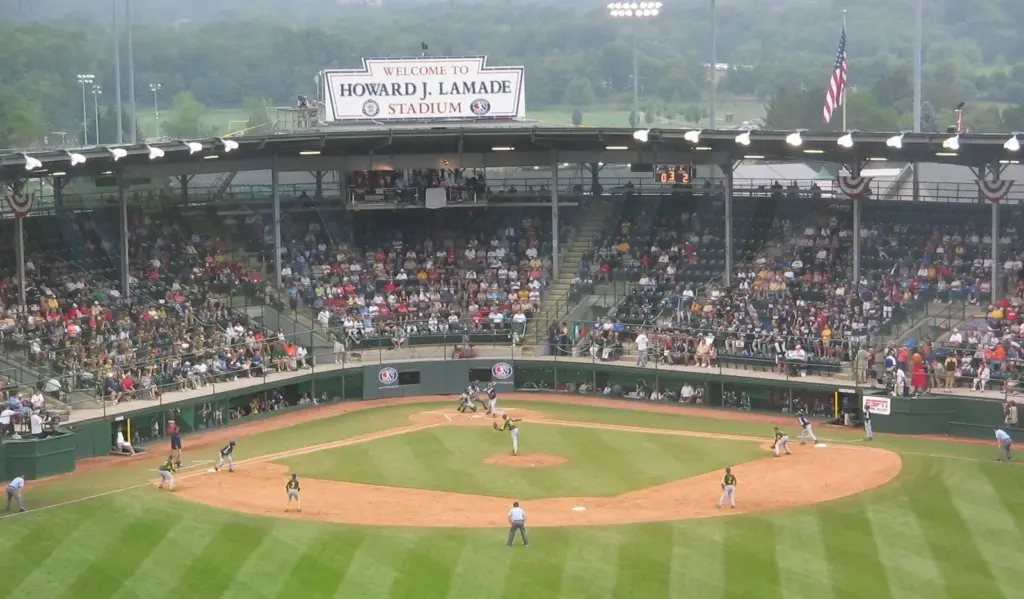 A Little League World Series game in progress at Howard J. Lamade Stadium with a full grandstand