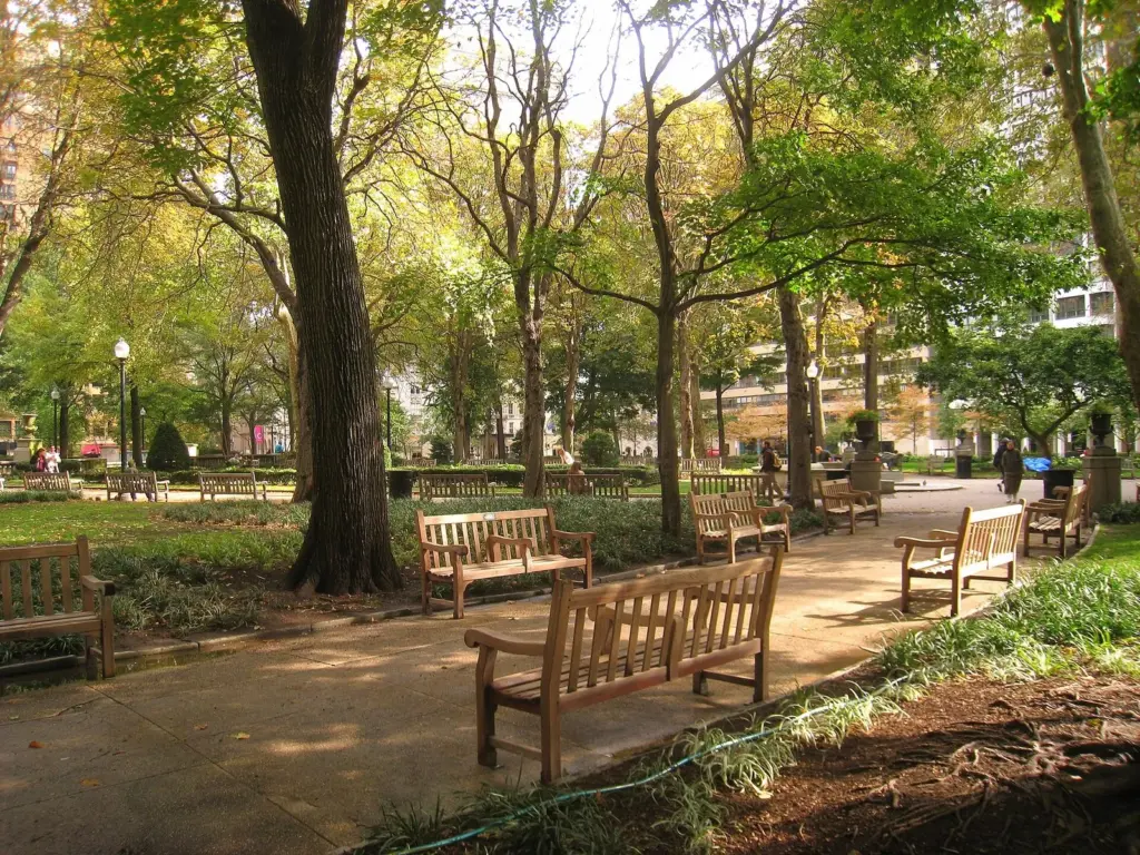Benches and paths under autumn trees in Rittenhouse Square