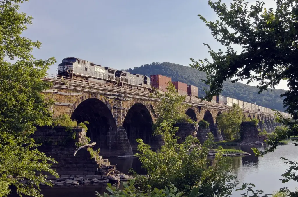 A freight train crossing the stone arches of Rockville Bridge over the Susquehanna River