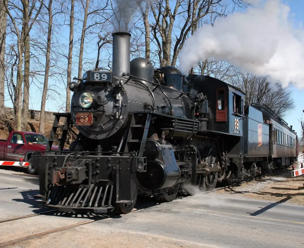 Strasburg Rail Road steam locomotive No. 89 backing along the line in a cloud of steam