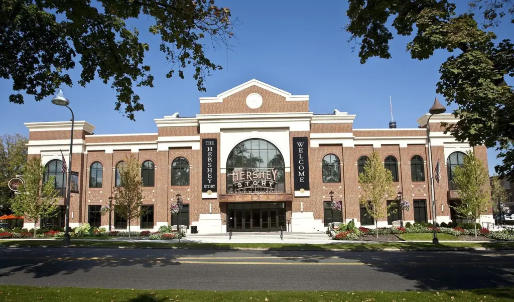 The brick front and arched entrance of The Hershey Story museum on Chocolate Avenue