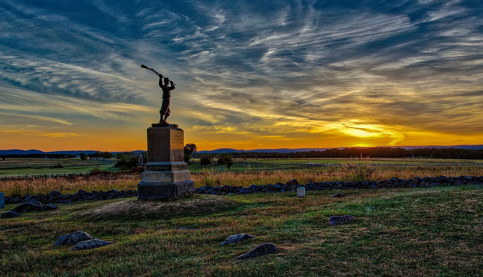 The 72nd Pennsylvania Infantry monument silhouetted against a September sunset at the Angle, one of the most moving things to do in Gettysburg
