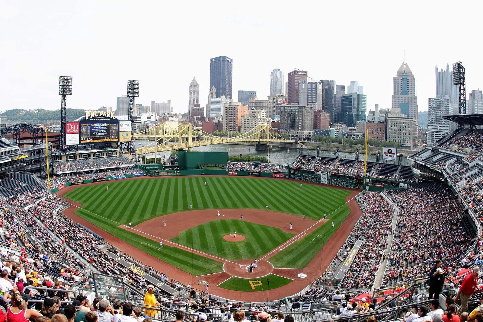 PNC Park's green field with the Roberto Clemente Bridge and the downtown skyline behind it, a favorite of things to do in Pittsburgh