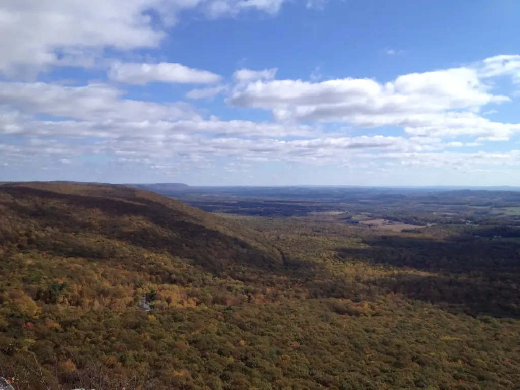 Fall forest and a farm valley seen from Bake Oven Knob on the Appalachian Trail