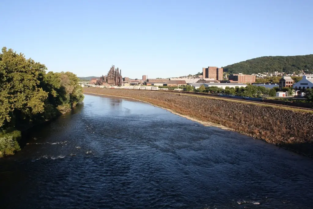 The Lehigh River in South Bethlehem with the dark Bethlehem Steel blast furnaces on the far bank