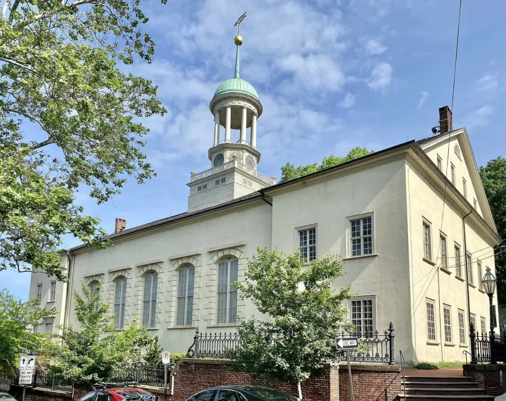 The pale stucco Central Moravian Church with its white cupola on Main Street in Bethlehem
