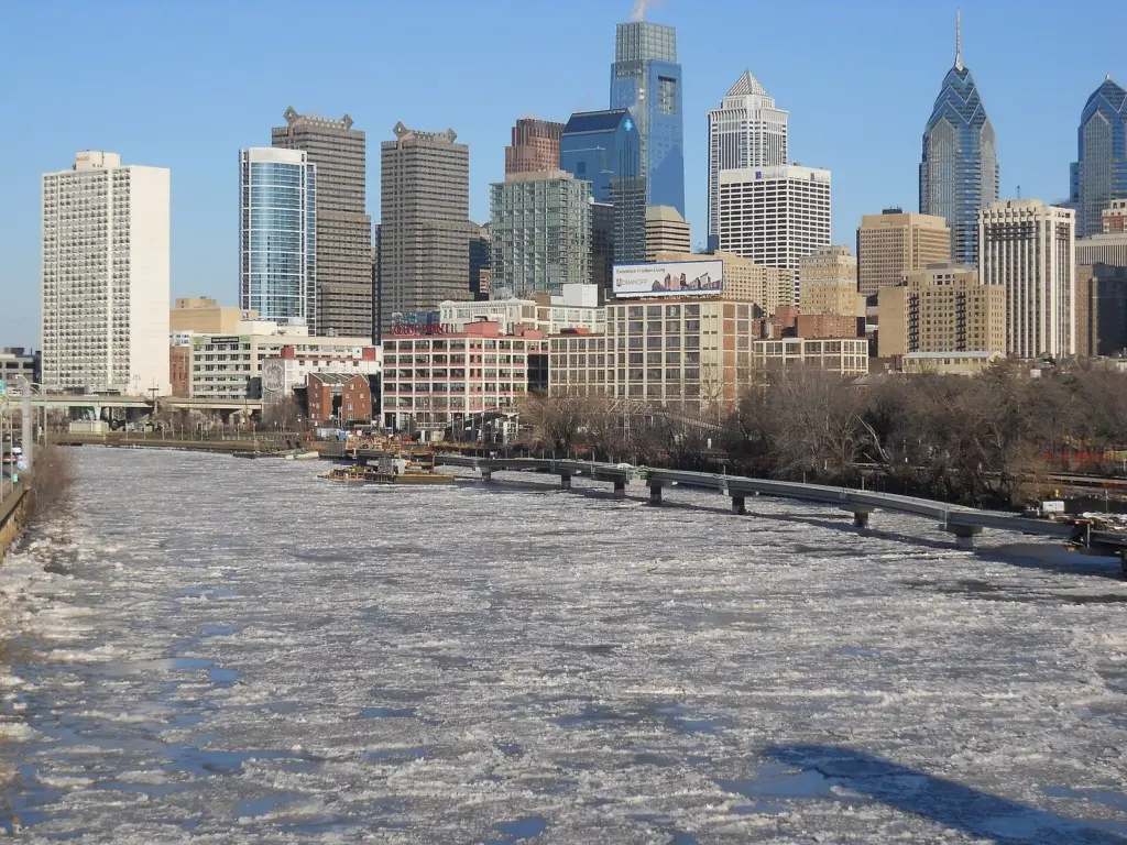 Ice covering the Schuylkill River in front of Philadelphia's skyline in January