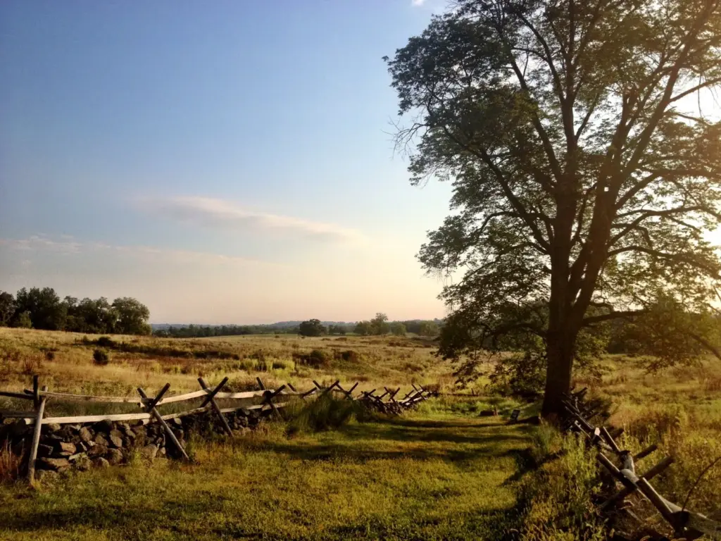 Split-rail fence and fields in early morning light on the Gettysburg battlefield