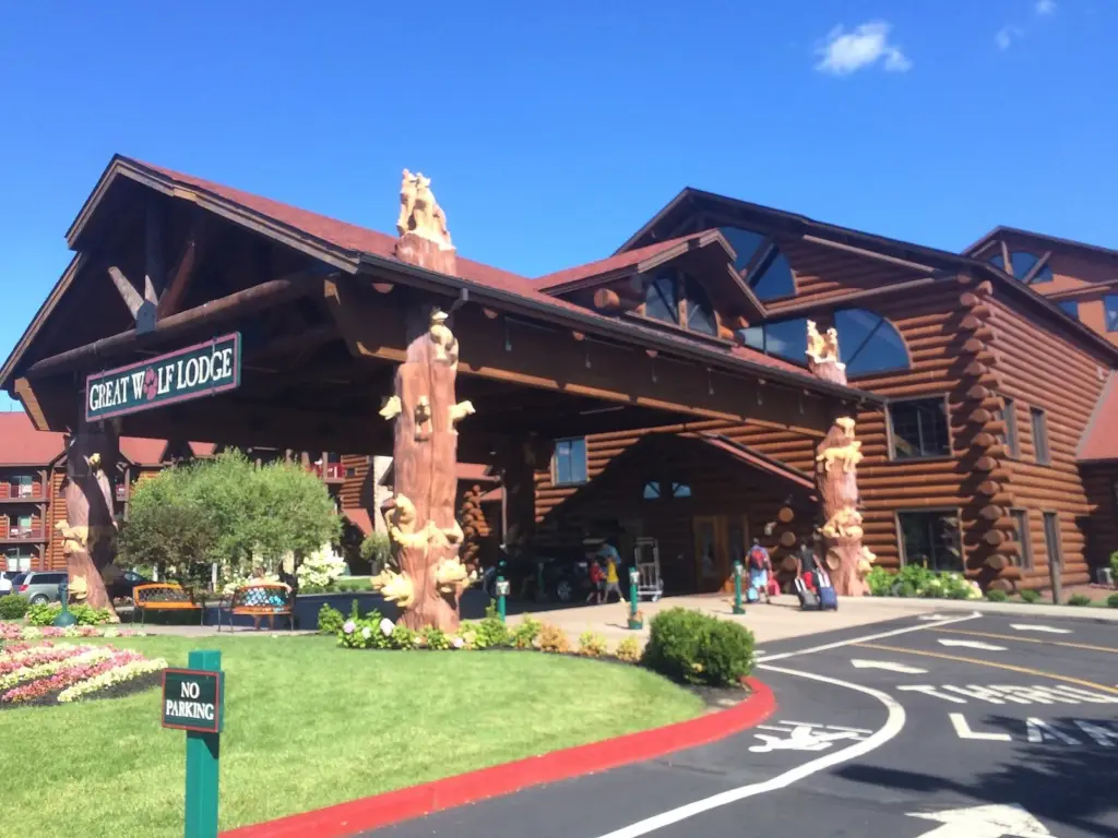 The log-style entrance of Great Wolf Lodge in the Pocono Mountains with carved wooden poles