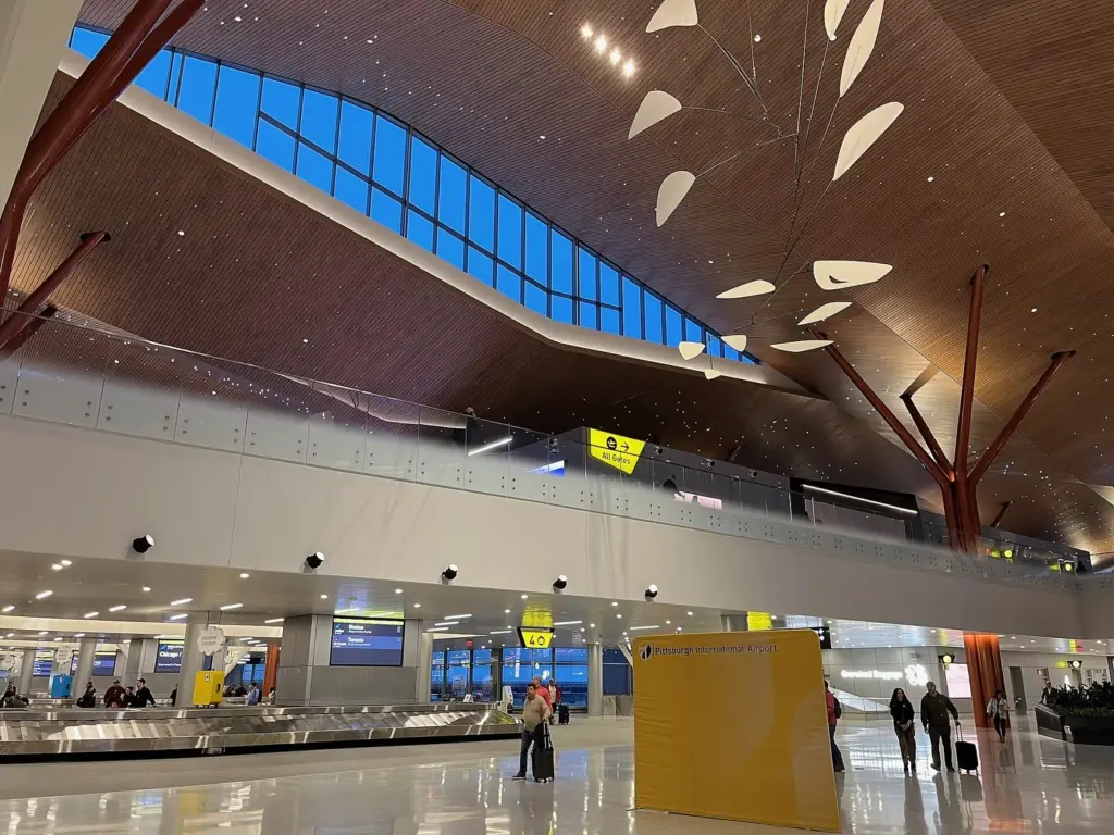Wood-lined ceiling and baggage claim hall in Pittsburgh International Airport's new terminal